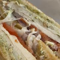 The Postman Panini · Grilled chicken breast, pesto mayo, provolone, red onions, and tomatoes on sliced sourdough ...
