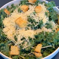 Kale Caesar Salad · Our kale Caesar salad is served with focaccia croutons and parmesan cheese. Add protein for ...