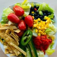 Tex-Mex Salad · Tomato, corn, jalapenos, black beans, peppers, and tortilla chips.