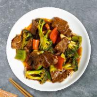Munchy Mongolian Beef · Sliced beef stir-fried with white and green onions in a Mongolian sauce over a bed of crisp ...