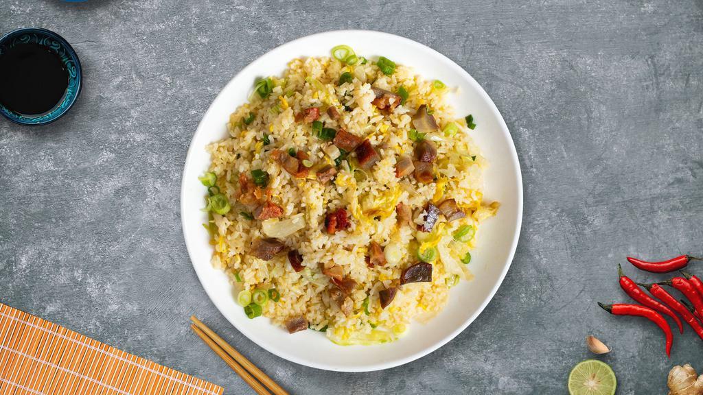 Porko Rosso Fried Rice · Pork pork pan-fried with steamed rice, egg, peas, and green onions.