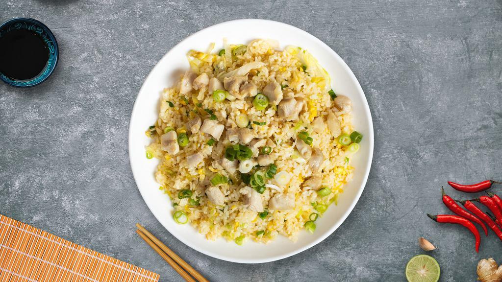 Cluck Cluck Fried Rice · Chicken pan-fried with steamed rice, egg, peas, and green onions