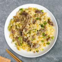 Beef Me Up Fried Rice · Thinly sliced beef pan-fried with steamed rice, egg, peas, and green onions