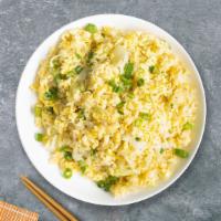 Eg, Egg and Eggy Fried Rice · Egg pan-fried with steamed rice, egg, peas, and green onions.