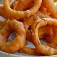 Onion Rings · Whole white onions cut and battered with a subtle blend of spices.