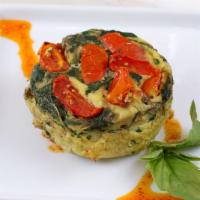 Muff Tata · Pasture raised eggs, cherry tomatoes, garlic, basil, spinach, rice milk