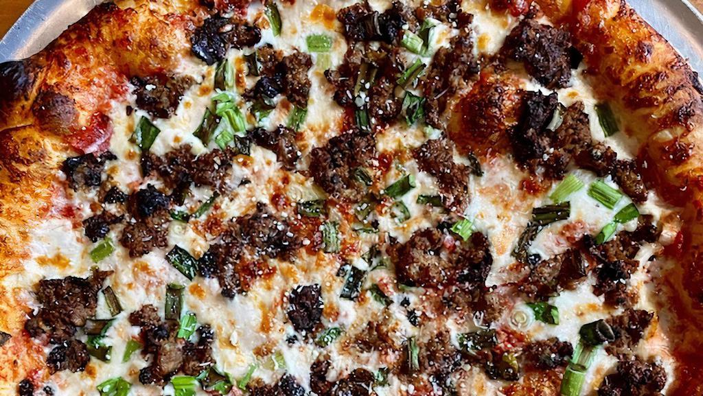 Piedmont Pizza · With hamburger and green onions.