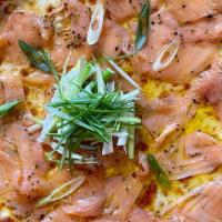 Alaska · With smoked salmon, cracked pepper, green onion, and olive oil.