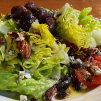 Insalata Emancipata · Delicious. With pecans, crumbled blue cheese, currants, and olives. Served with extra virgin...