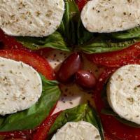 Caprese Salad · Sliced vine-ripe tomatoes, fresh mozzarella, and sweet basil.