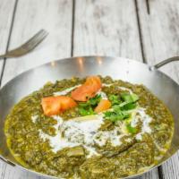 Palak Paneer · Cheese cubes cooked with spinach and spices.