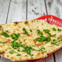Garlic Naan · Naan topped with chopped garlic and cilantro.