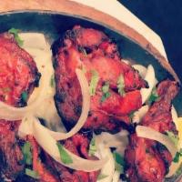 Chicken Leg Tandoori (2 pcs) · Marinated chicken leg cooked in a clay oven.