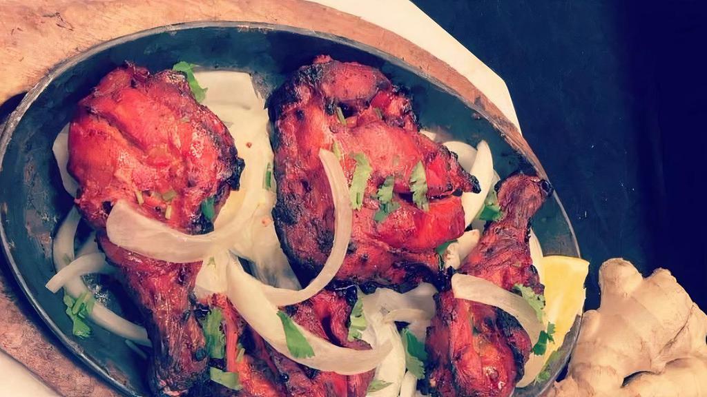 Chicken Leg Tandoori (2 pcs) · Marinated chicken leg cooked in a clay oven.
