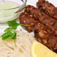 Lamb Seekh Kebab (2 pcs) · Ground lamb marinated and coked in a clay oven on skewers.