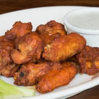 Buffalo Chicken Wings · Gluten-free. Sprinkled with Danish Bleu cheese and fennel, with celery sticks and ranch dres...