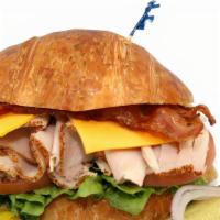37. Turkey Club & Cheese · Turkey, Lettuce, Tomato, Mayonnaise, cheese. 
On the side: Pickle, Pepperoncini, Red Onion &...