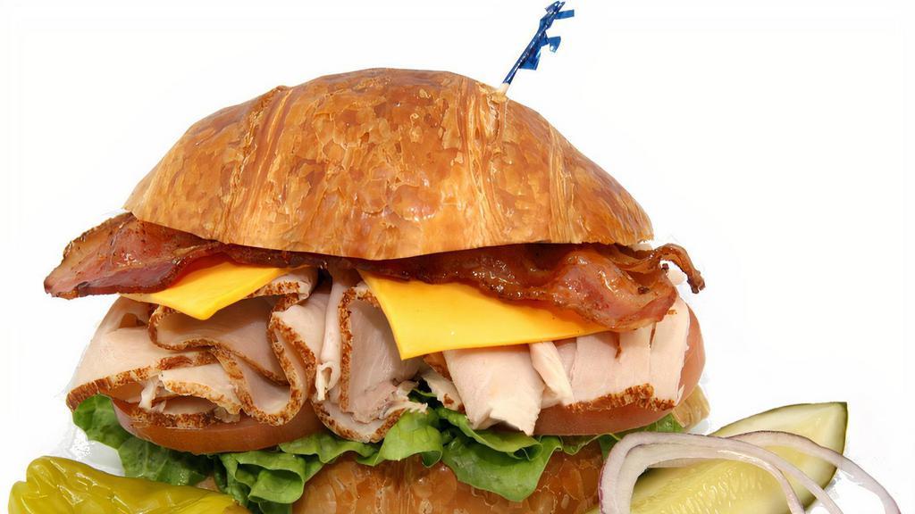 37. Turkey Club & Cheese · Turkey, Lettuce, Tomato, Mayonnaise, cheese. 
On the side: Pickle, Pepperoncini, Red Onion & Mustard.