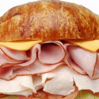 33. Ham, Turkey & Cheese  · Ham, Turkey, Lettuce, Tomato, Mayonnaise, Cheese.
On the side: Pickle, Pepperoncini, Red Oni...