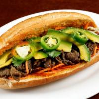 Banh Mi · Grilled chicken, beef or tofu on a warmed roll with homemade sriracha-mayo and topped with p...