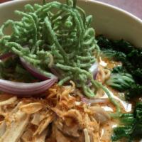 Kao Soi (Noodle Curry) · Egg noodles in a spicy/creamy coconut sauce with chicken, bok choy, red onions, and topped w...