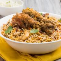 Chicken Biryani · Fresh chicken marinated in Indian spices on a bed of basmati rice.