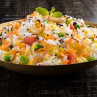 Vegetable Biryani · Farmer's market fresh vegetables marinated in Indian spices on a bed of basmati rice.
