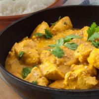 The Chicken Coconut Korma Bowl · Coconut mixed in with korma sauce and cooked with boneless chicken, served in a bowl with sa...