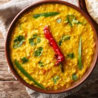 Dal Tadka · Customers favorite! Yellow lentils sautéed with ginger, garlic, onions, tomatoes and red chi...