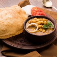 Chole Bhature · Classic Punjabi dish made with garbanzo beans. Served with fried Indian Puri (bread).