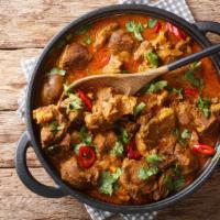 Kashmiri Lamb · Chef's cooked lamb in onions and chef's special tomato sauce and Indian spices.