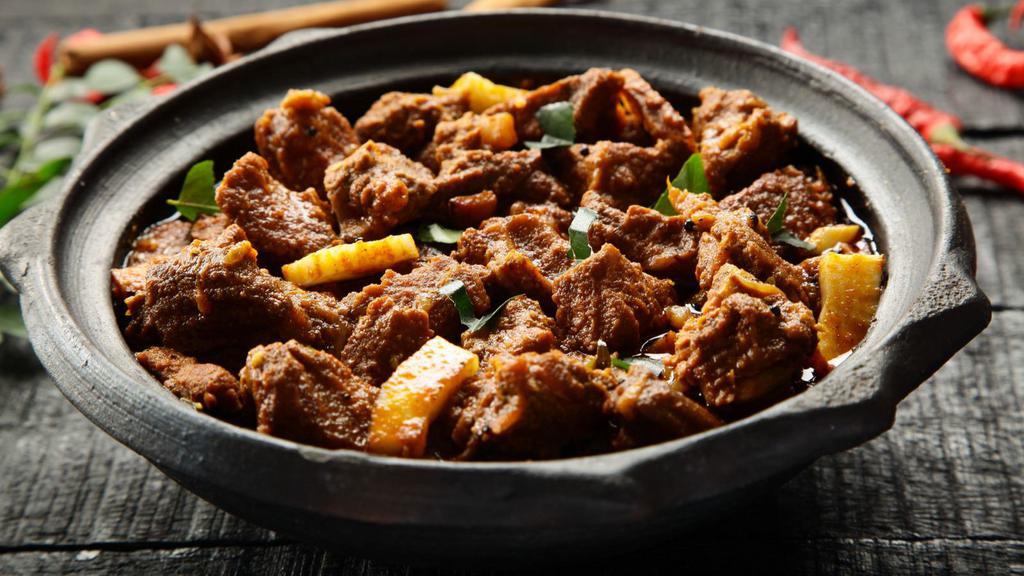 Goat Curry · Fresh goat meat cooked in onion based.