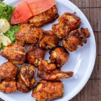 Chicken Tikka Kebab · Boneless chicken kebabs marinated and cooked in clay oven.