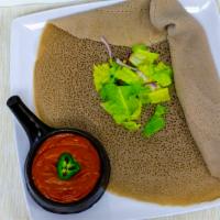 Shiro Wot · Ground split peas cooked in flavorful hot berbere (pepper), onion, garlic, and Ethiopian cla...