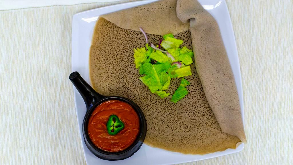 Shiro Wot · Ground split peas cooked in flavorful hot berbere (pepper), onion, garlic, and Ethiopian clarified butter.