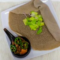 Beef Or Chicken Tibs · Tender pieces of meats sautéed in seasoned Ethiopian spiced butter with onions, garlic, and ...