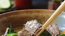 Brisket Pho · Brisket in beef broth garnished with onion, scallion, cilantro, and a side of bean sprouts, ...