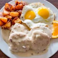 Southern Breakfast · Two biscuits and gravy with two eggs cooked your way, served with hash browns or country pot...