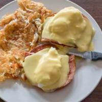 Classic Eggs Benedict · We grilled an English Muffin, then we add Ham, two poached eggs topped with our secret recip...