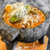 Molcajete · Serves two. Grilled chicken and steak, grilled cactus, chorizo, in our molcajete salsa. Serv...