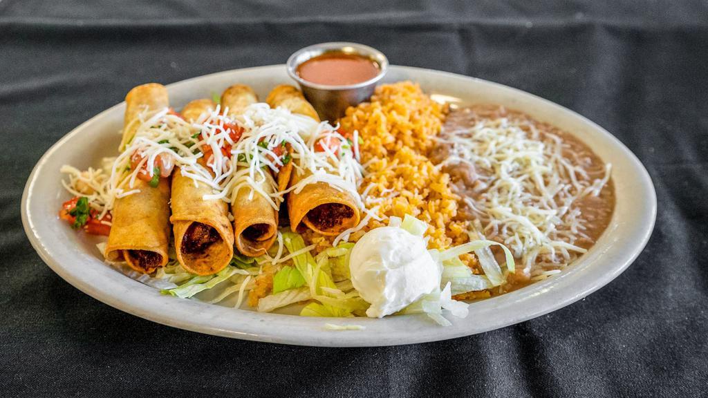 Flautas · Four pieces. Fried corn tortillas with chicken, with lettuce, sour cream, salsa, pico de gallo, rice, and beans.