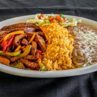 Fajitas · Grilled chicken or steak, with grilled onions and bell peppers. Served with lettuce, pico de...