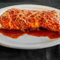 Wet Burrito · Choice of meat, beans, rice, Monterey Jack cheese, sour cream, and guacamole, covered with r...