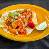 Shrimp Taco · Shrimp sautéed with mild salsa on a flour tortilla with lettuce, and pico De gallo.