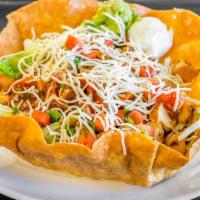Taco Salad · Tortilla shell with your choice of meat, lettuce, black beans, rice, Monterey Jack cheese, s...