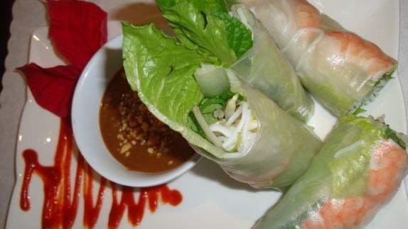A1. Shrimps Spring Rolls / Gỏi Cuốn Tôm (4) · Rice paper wrapped with shrimps, vermicelli noodles, beansprouts, lettuce, and mints. Served with side of peanut sauce.