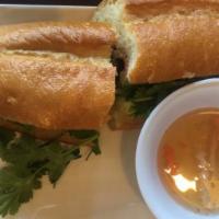 A6. Famous Vietnamese Sandwich / Bánh Mì · Spicy. Choice of pork, chicken, beef, sunshine up eggs or tofu stuffed with mayo, chicken pa...