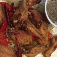 A3. Salt & Pepper Chicken Wings / Cánh Gà Chiên Giòn · Spicy. Crispy battered fried with onions, bell peppers, and jalapeños. Served with lime sauce.