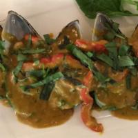 A8. New Zealand Green Mussels Curry Thai Basil/Chem Chép Cari · Spicy. Steamed green mussels topped with yellow curry coconut milk sauce and Thai basil.