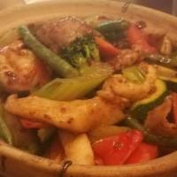 C10. House Special (Combo Rice Clay Pot/Cơm Tay Cầm) · Sizzling hot and crispy rice topped with mixed veggies, shrimps, chicken, and beef. Served i...